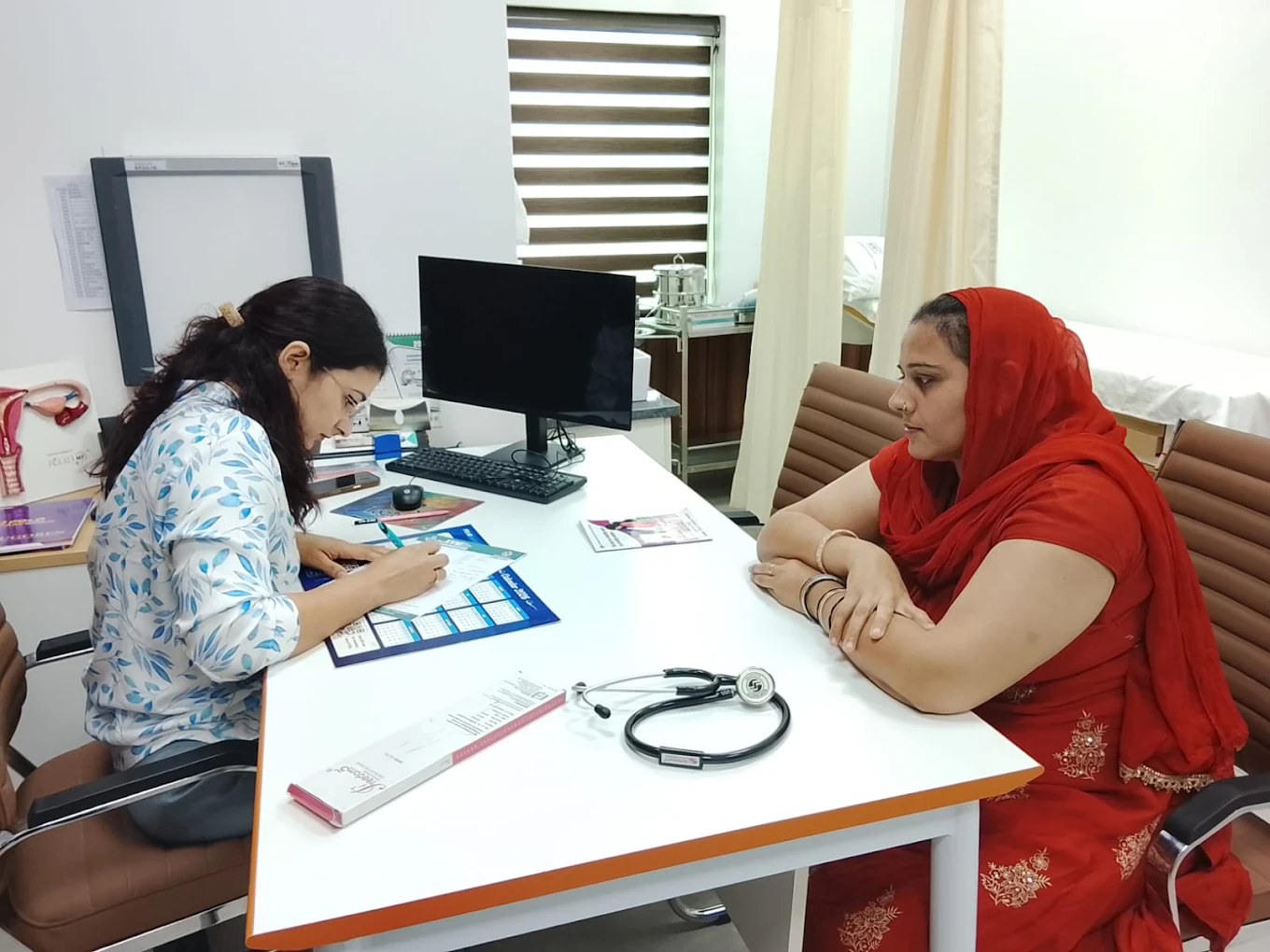 Doctor checking a patient's knee joint